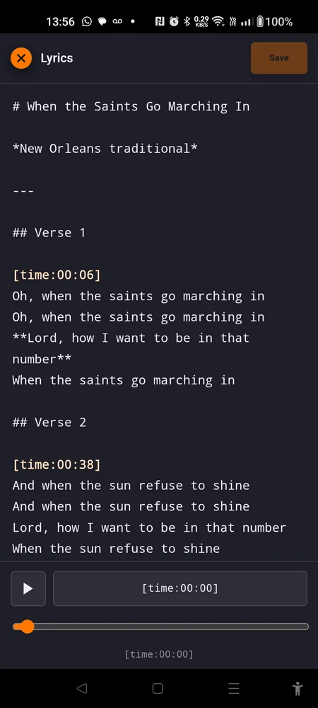 The lyrics editor in portrait: the text area with two orange marks visible, the Save button in the header, the transport row at the bottom
